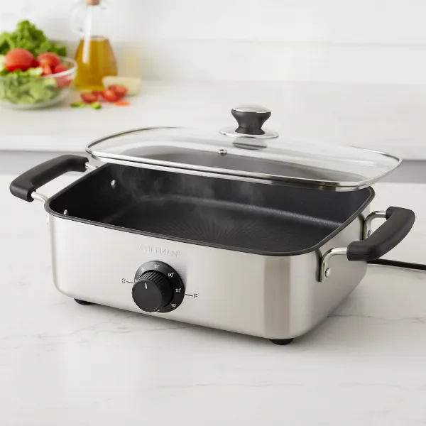 Chefman electric skillet with lid, cool-touch handles, and temperature control probe.