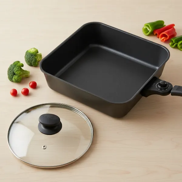 Nesco 12-inch electric skillet with high walls, non-stick interior, glass lid, and temperature control.