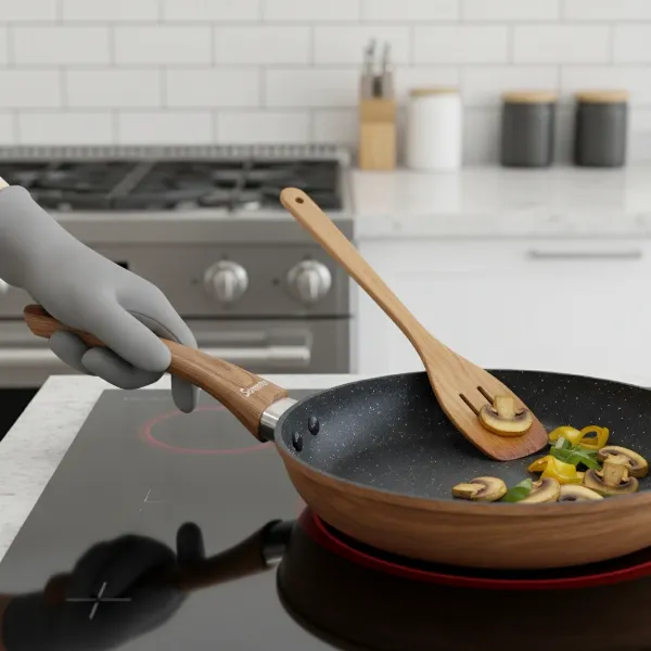 Hand holding Sensarte pan with comfortable wood-grain handle and nonstick surface.